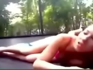 Voluptuous young young lady fucks on a trampoline